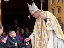 Bishop James Wall greets young parishioners in the Diocese of Gallup. Courtesy photo