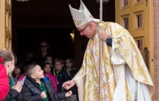 Bishop James Wall greets young parishioners in the Diocese of Gallup. Courtesy photo 