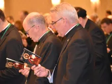 Bishops pray at the 2019 USCCB fall general assembly in Baltimore. 