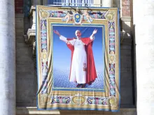 A tapestry of Bl. Paul VI hangs from the facade of St. Peter's Basilica at his Mass of beatification. 
