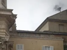 Black Smoke pours out of the chimney of the Sistine Chapel as seen from St. Peter's Square. 