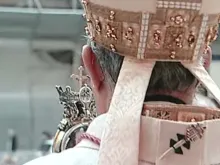 The Archbishop of Naples blesses the city with St. Januarius' liquefied blood. 
