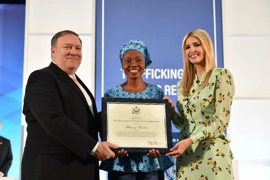 Blessing Okoedion (C) accepts a Trafficking in Persons Hero award from US Secretary of State Mike Pompeo and presidential advisor Ivanka Trump. ?w=200&h=150