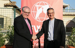 EWTN CEO Michael Warsaw and Msgr. Dario Viganò, prefect of the Secretariat for Communications, celebrate the dedication of the EWTN News Rome Bureau, Sept. 29, 2016.   Daniel Ibanez/CNA.