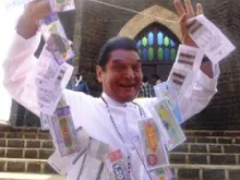 A scene from "Kamaal Dhamaal Malamaal" in which a priest is shown dancing with a string of lottery tickets.
