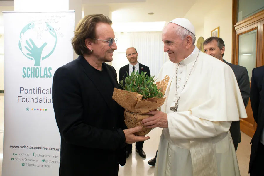 Bono gives Pope Francis a plant at the Vatican's Casa Santa Marta, Sept. 19, 2018. ?w=200&h=150