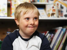 Boy with Down syndrome in a classroom. 