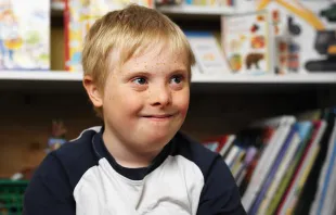 Boy with Down syndrome in a classroom.   George Doyle/Stockbyte.