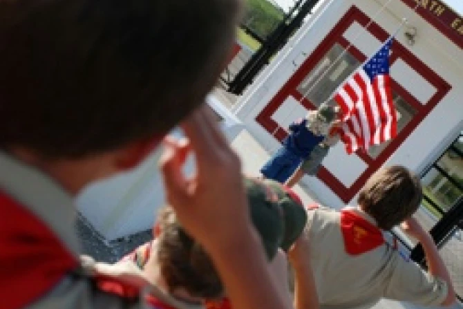 Boy Scouts salute the american flag Credit US Navy photo by Mass Communication Specialist Nat Moger CNA US Catholic News 7 23 12