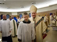 Brett Haubrich with Archbishop Carlson of St. Louis. 