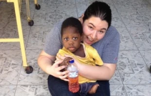 Briana Silva, a CUA student, with Bob at Bethlehem House in Kingston, Jamaica.   The Catholic University of America/Catherine Lee.