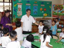 Brother Armin Luistro (center) visits a classroom, July 2013. 