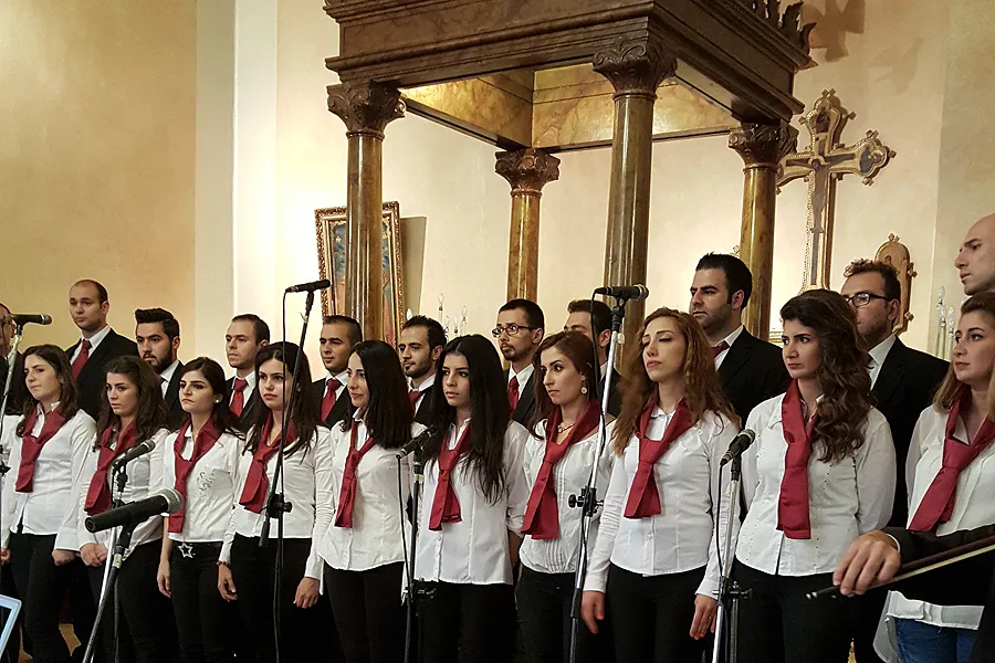 A young adult choir prepares to perform at a celebration for Archbishop Jeanbart's ?w=200&h=150