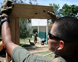 A U.S. soldier assists with rebuilding efforts in Haiti?w=200&h=150