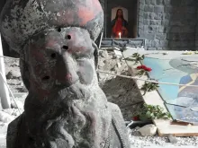 A bullet-riddent bust of St. Ephrem in the remains of St. Mary's Syrian Orthodox parish in Homs. Photo courtesy of Aid to the Church in Need.