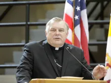 Archbishop Thomas Wenski speaks at a press conference. 
