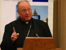 Cardinal Dolan speaks during a conference on communications at Santa Croce University in Rome on April 29, 2014. 