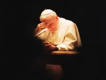 Pope John Paul II at prayer in 1991. 