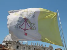 The flag of Vatican City with St. Peter's Basilica in the background on May 29, 2015. 