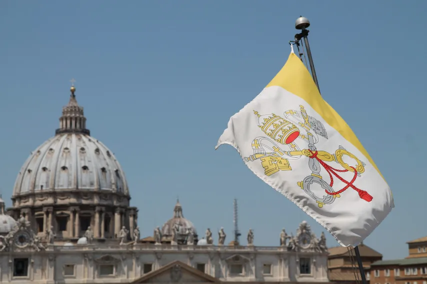 The flag of Vatican City with St. Peter's Basilica in the background. ?w=200&h=150