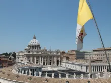 The flag of Vatican City with St. Peter's Basilica in the background on April 29, 2019. 