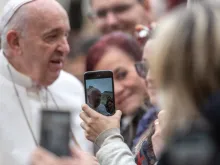 Pope Francis greets pilgrims after the Wednesday general audience in St. Peter's Square on Feb. 26, 2020. 