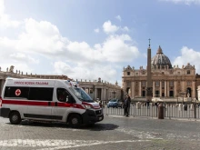 A red cross ambulance passes in front of the Vatican as Italy prepares for the coronavirus, March 9, 2020. 