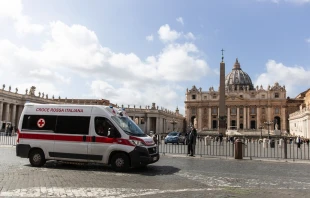 A red cross ambulance passes in front of the Vatican as Italy prepares for the coronavirus, March 9, 2020.   Daniel Ibáñez/CNA