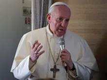 Pope Francis speaks during an in-flight press conference.