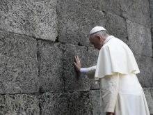 Pope Francis prays during his visit to Auschwitz July 29, 2016. 