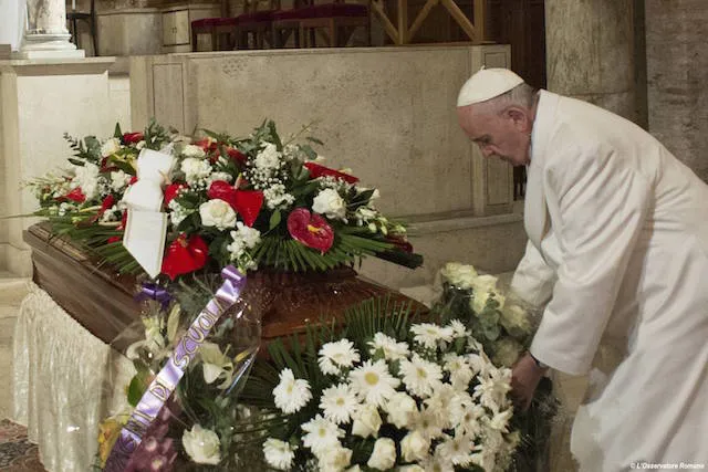 Pope Francis lays a bouquet on Vatican employee Miriam Wuolou's coffin Feb. 20, 2016. ?w=200&h=150
