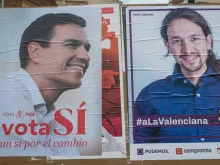 Campaign posters depicting PSOE leader Pedro Sanchez and Podemos leader Pablo Iglesias.