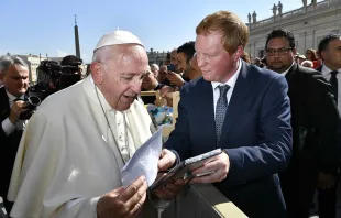 Campbell Miller presents a copy of "Bravery Under Fire" to Pope Francis Oct. 10, 2018.   Vatican Media.