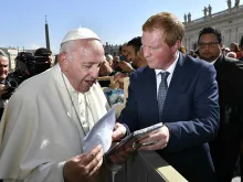 Campbell Miller presents a copy of "Bravery Under Fire" to Pope Francis Oct. 10, 2018. 