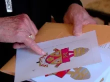 Cardinal Andrea Cordero Lanza di Montezemolo shows his draft of what Benedict XVI's new coat of arms could look like during a May 2, 2013 interview. 