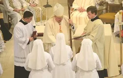 Cardinal Dolan distributes the Constitutions of the Congregation to the newly professed. ?w=200&h=150