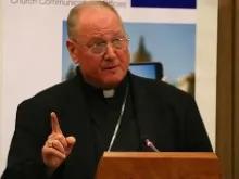 Cardinal Timothy Dolan of New York speaking during the communications conference at Rome's Pontifical University of the Holy Cross, April 29, 2014. 