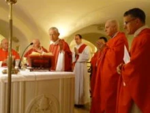 Cardinal Donald W. Wuerl (center) celebrates Mass with Cardinal-designate Edwin O'Brien and Archbishop Timothy Broglio to his left at tomb of St. Peter on Jan. 16, 2012