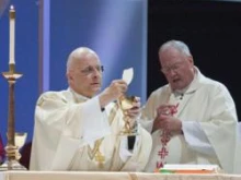 Cardinal Francis George and Archbishop Timothy Dolan celebrate Mass at the Love and Life Center on Saturday morning