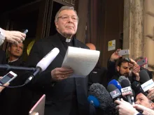 Cardinal George Pell, prefect of the economy secretariat, speaks to reporters outside Rome's Hotel Quirinale after meeting with sex abuse survivors, March 3, 2016. 