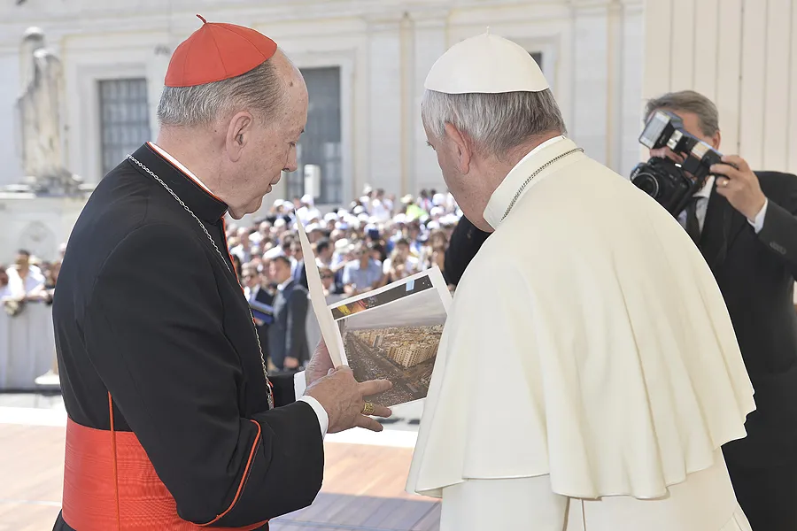 Cardinal Juan Luis Cipriani and Pope Francis in St. Peter's Square viewing photos from the March for Life in Lima, Peru on June 3, 2015. ?w=200&h=150