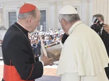 Cardinal Juan Luis Cipriani and Pope Francis in St. Peter's Square viewing photos from the March for Life in Lima, Peru on June 3, 2015. 