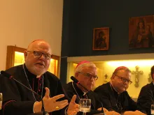 Cardinal Reinhard Marx of Munich and Freising (L) speaks at a press conference held by German bishops at the Teutonic College, Oct. 5, 2015. 