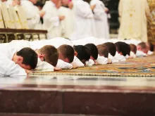Ordinandi lay prostrate during the Litany of Saints during an Ordination Mass in St. Peter's Basilica, Sept. 29, 2016. 