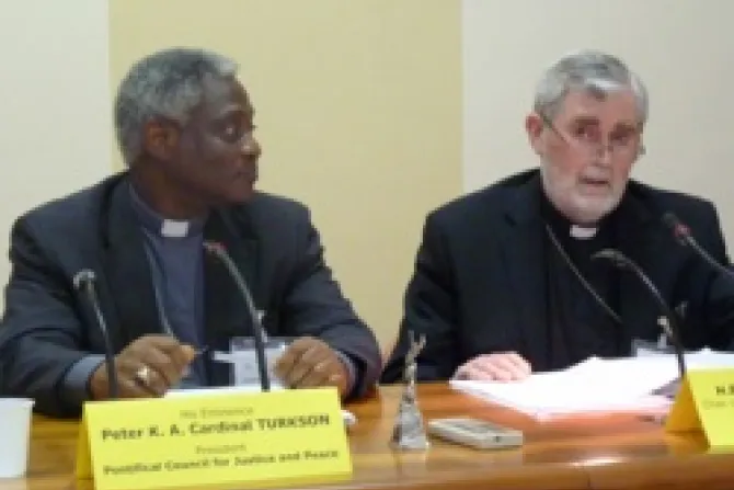 Cardinal Peter KA Turkson president of the Pontifical Council for Justice and Peace listens as Aux Bishop Patrick Lynch of Southwark England speaks CNA Vatican News 5 9 12