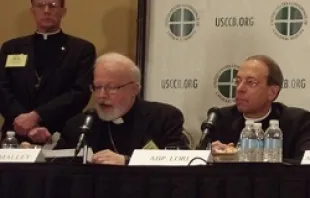 Cardinal Sean O'Malley and Archbishop William Lori speak at a 2012 USCCB conference.  