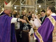 Cardinal Timoth Dolan blesses expectant mothers in St. Patrick's Cathedral in New York City on April 6, 2014. 