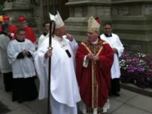 Cardinal Timothy Dolan (L) with Bishop Richard J. Malone, as they process into St. Joseph Cathedral. Photo courtesy of Keenan Communications Group.