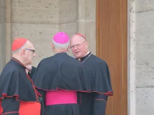 Cardinal Timonth Dolan speaks with bishops outside the Vatican's Synod Hall on Oct. 13, 2014. 