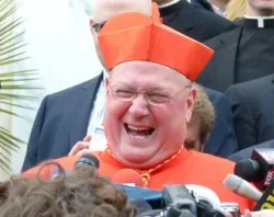 Cardinal Timothy Dolan greets the press in Rome in March 2012.?w=200&h=150